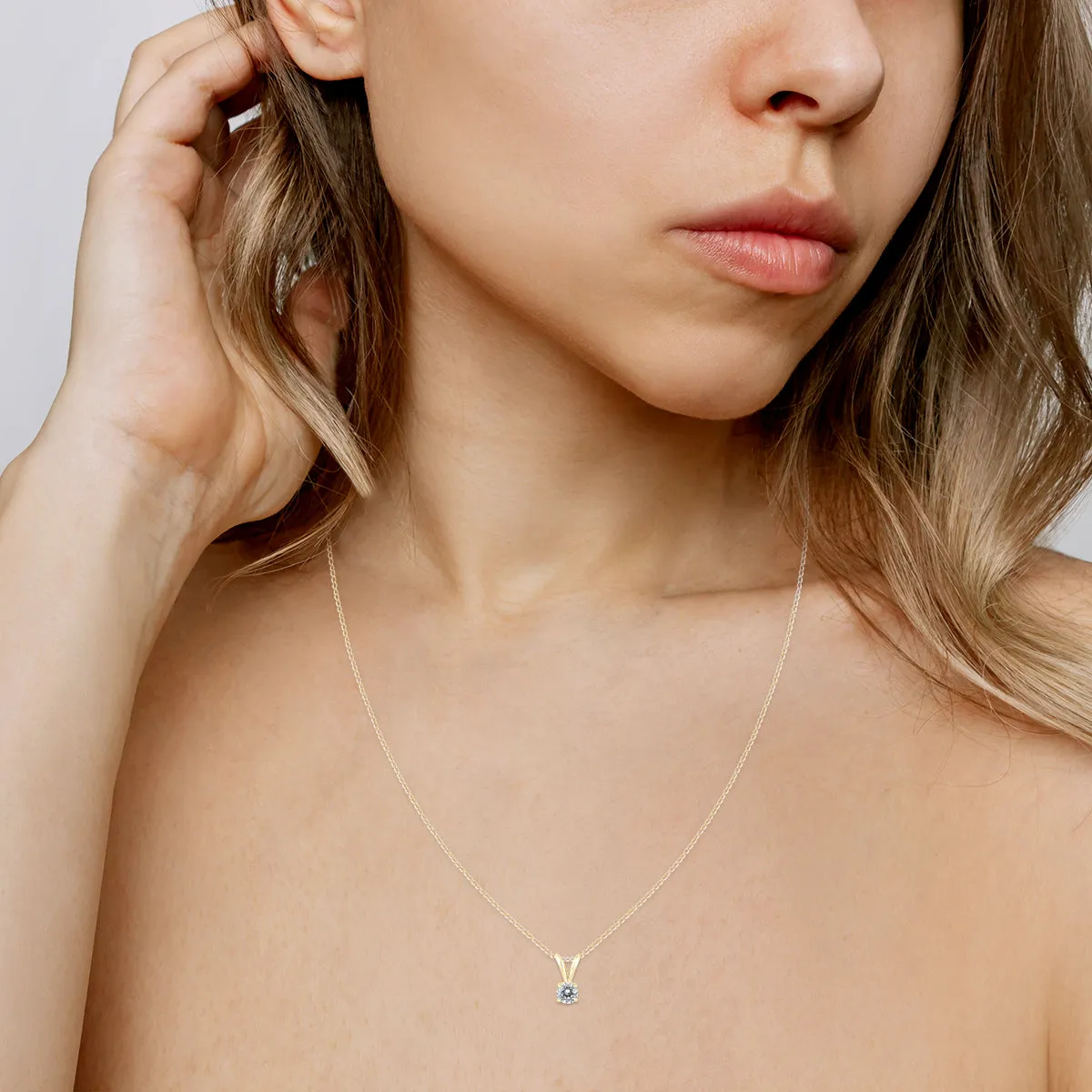 1/7 Carat Round Diamond Solitaire Pendant In 14K Yellow Gold