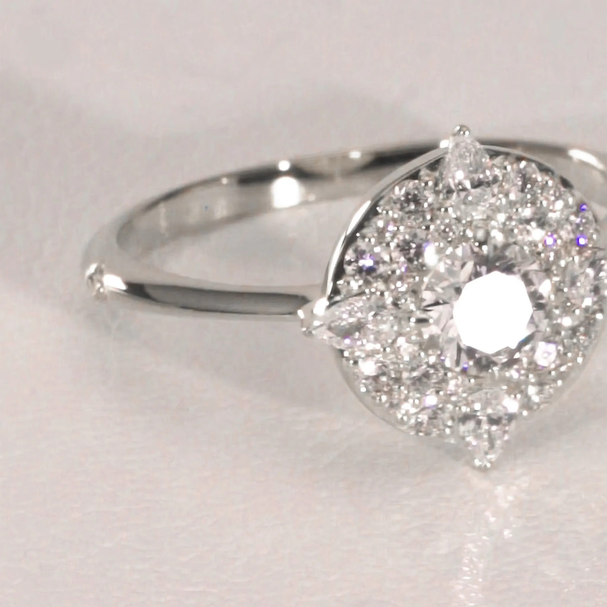 "Points North" Diamond 18K White Gold Ring with Round and Pear Shaped Diamonds